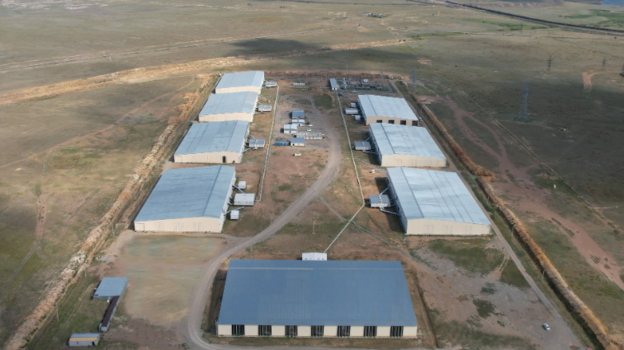 Rows of mining machines inside a large industrial facility