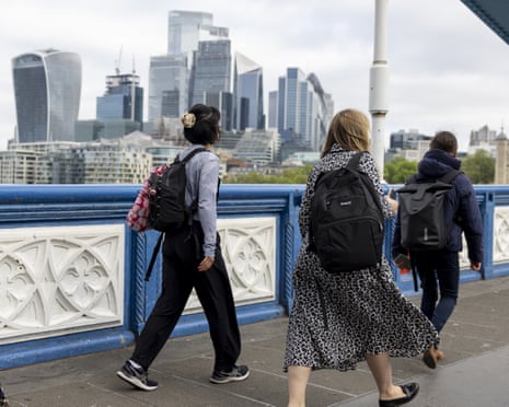 Office workers walking through a City of London financial district
