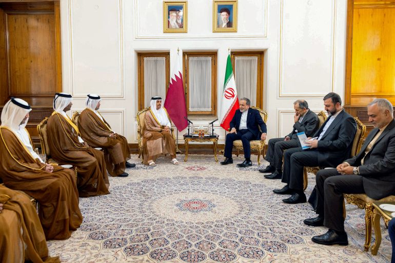Officials from Qatar and Iran meeting around a table