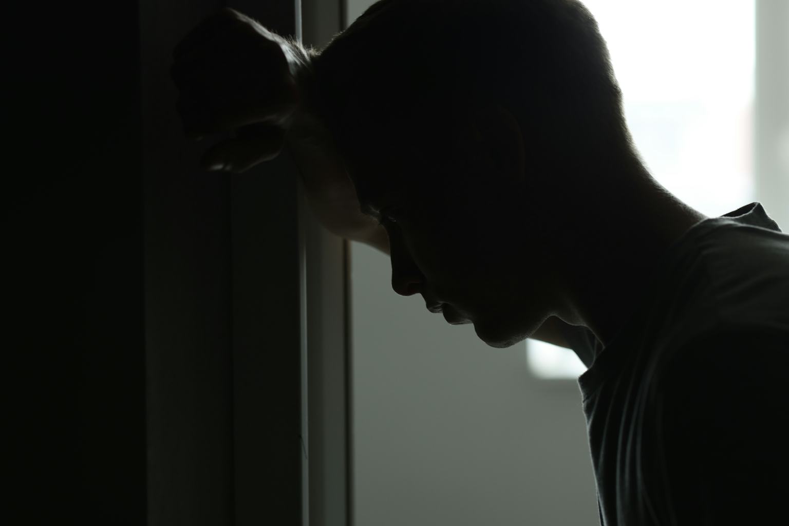 A young person sitting alone
